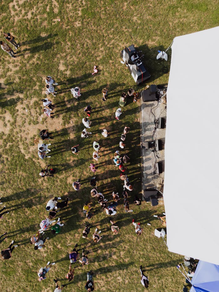 Drone shot capturing a vibrant crowd at an outdoor concert in Chattanooga.